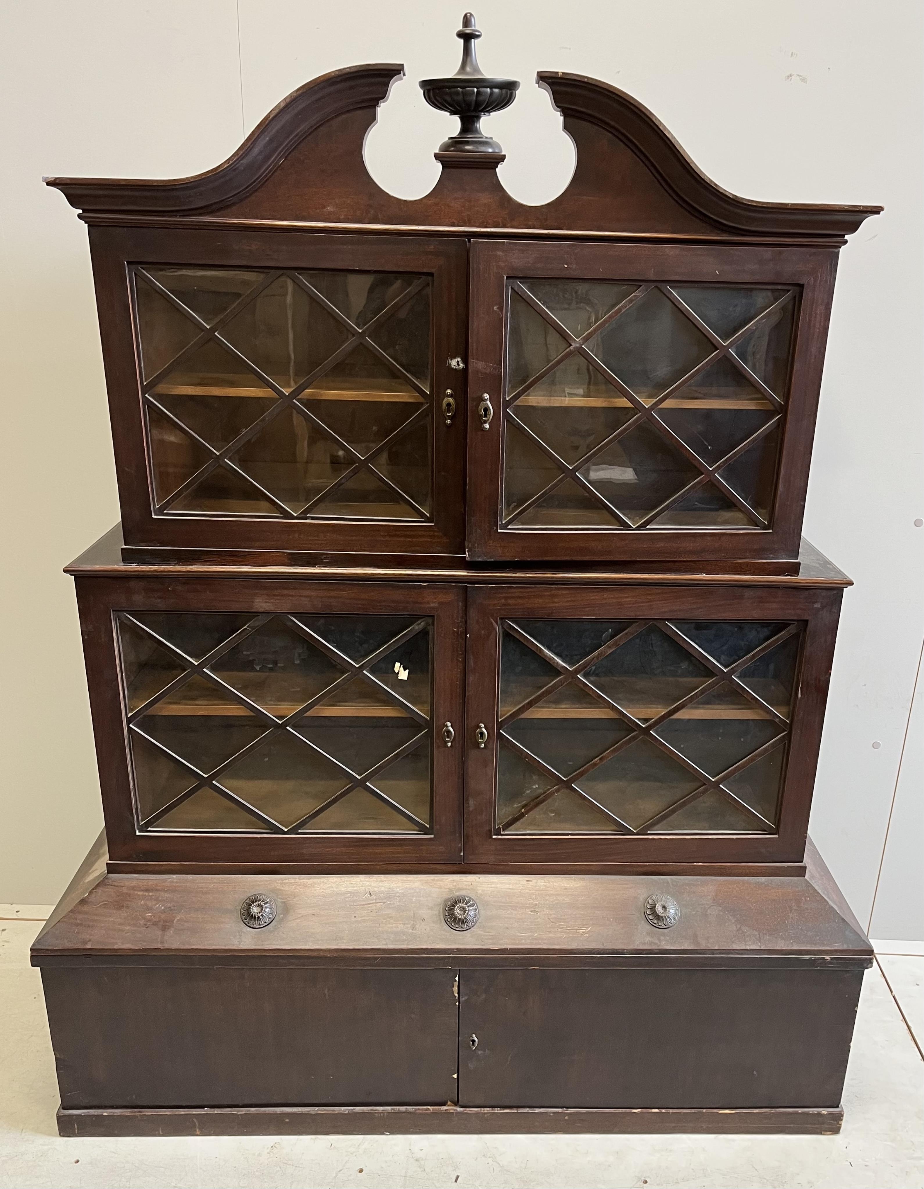 A George III style mahogany three section bookcase / cabinet, incorporating old timber, width 126cm, depth 47cm, height 160cm. Condition - fair